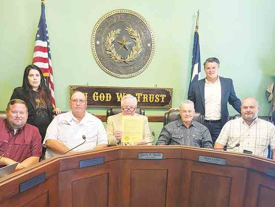 County tweaks pay scales, fields questions