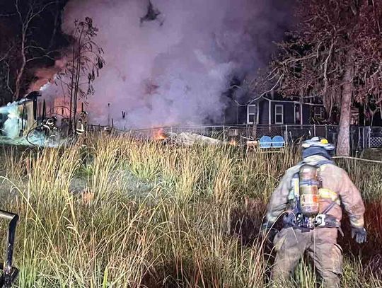 Departments battle house fire