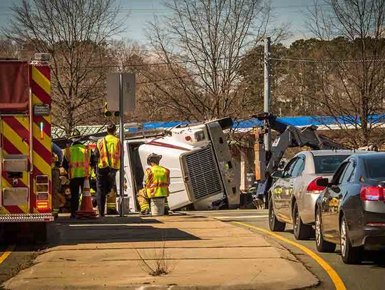 Pickup, log truck collision results in injuries