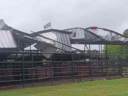 Winds from Beryl peeled back the roof of some of the livestock pens at Barney Wiggins Memorial Arena