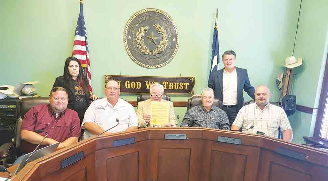 County tweaks pay scales, fields questions