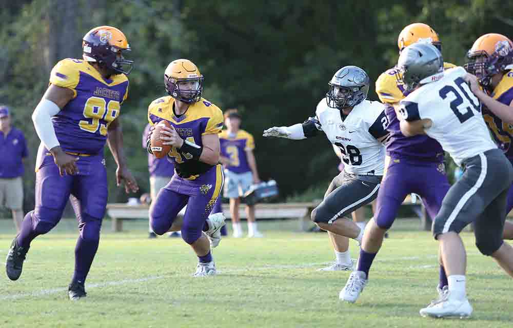 Quarterback Jesse Bittick looks for a receiver while Keighen Green covers. BECKI BYRD | TCB