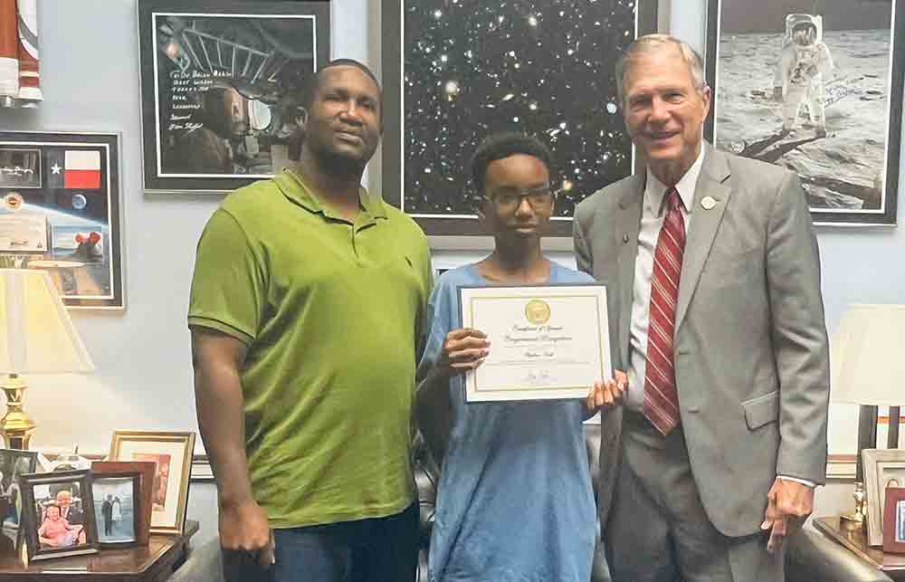 Pictured, left-to-right: Stephen Scott Jr., Stephen Scott III, and Rep. Brian Babin. COURTESY PHOTO