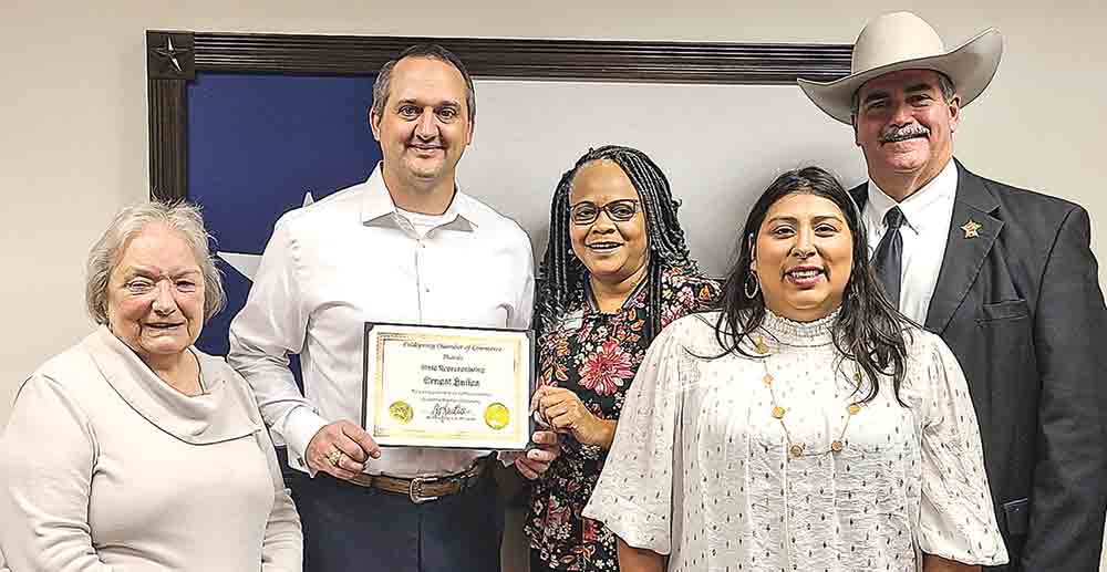 Ernest Bailes receives award from Coldspring Chamber board members at the capitol in Austin. Courtesy photo