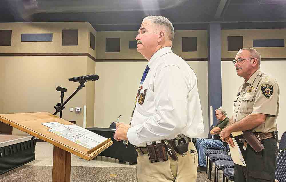 San Jacinto County Sheriff Greg Capers addresses the Commissioners Court regarding a $1.75 million grant application.  Photo by Tony Farkas