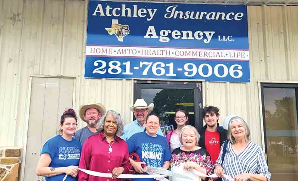 A ribbon cutting for Atchley Insurance.