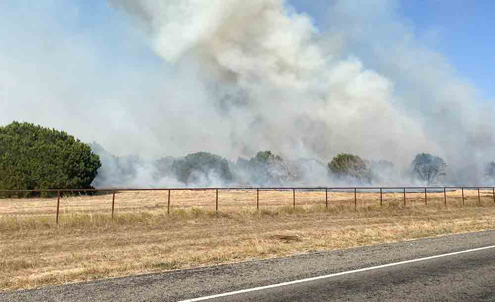 Trinity, Groveton and Apple Springs firefighters work grass fires in the area, which are potentially dangerous because of dry conditions. COURTESY PHOTOS