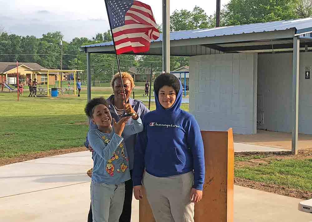 Crockett Mayor Dr. Ianthia Fisher poses with young Aziyah and Aziuna Mitchell, who led attendees of the meeting of the Crockett City Council in the Pledge of Allegiance on Monday. JAN WHITE | HCC