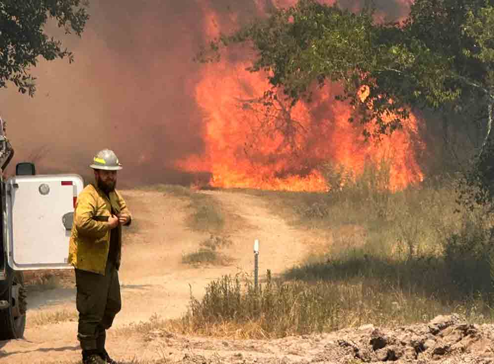 The Apple Springs and Groveton fire departments fought a large grass fire on Monday. COURTESY PHOTO