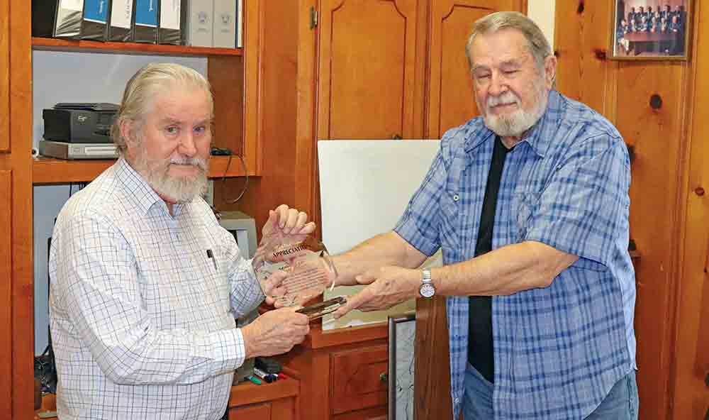 Tyler County Special Utility District general manager Jerry Lovelady was presented with a special token of appreciation for his leadership from the SUD board of directors at the board’s Tuesday morning meeting. Outgoing SUD president Jim Boone is shown presenting him with the award.  CHRIS EDWARDS | TCB