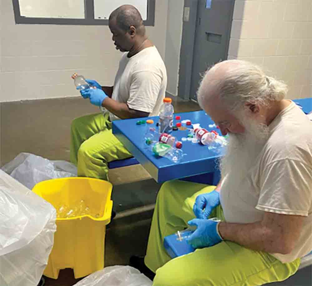 Resident workers at the IAH Secure Adult Detention Facility are shown preparing recyclable material for delivery to the Polk County Recycling Center at 10311 N. Hwy 146 in Livingston at the intersection of Hwy. 146 and FM 2665. Caps from the plastic bottles are bagged separately and collected by themselves. Courtesy photo