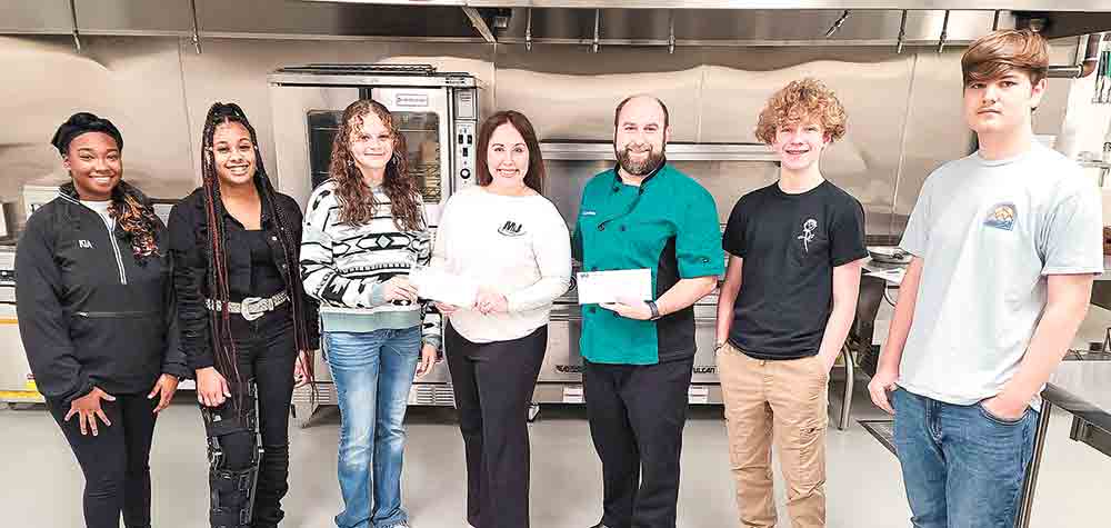  Business owner M.J. Coker presented two donations to the COHS CTE program to help students compete at the upcoming SkillsUSA competitions in February. Pictured from left: COHS Senior Kia McGowen, Senior Amani Harwig, Freshman Leeann Isaacks, MJ Coker - President of M&J Electrical Supply, SkillsUSA Advisor Chef Joel Casiday, Freshman Nathan Dolney, and Sophomore Ashton Smith, Photo by Cassie Gregory