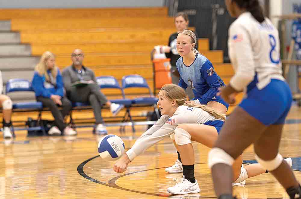 Abbey Anderson digs a ball and sets it up for a perfect return as Chloe Fuller (No. 2) and Jazllyn Richardson (No. 8) watch. Phots by Charles Ballard