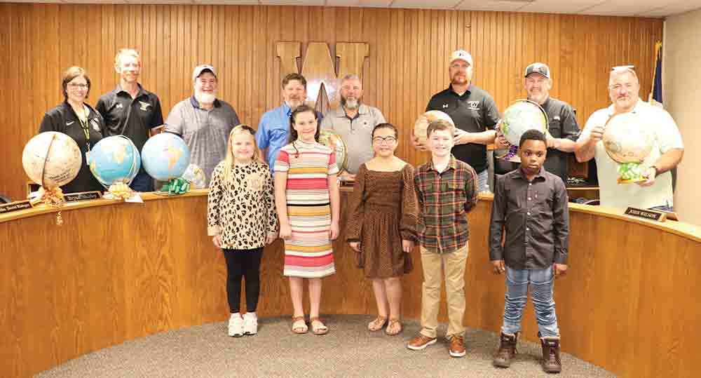 Woodville Elementary and Intermediate Gifted and Talented students presented the WISD Board of Trustees with customized globes as gifts for their leadership in moving the district forward. CHRIS EDWARDS | TCB