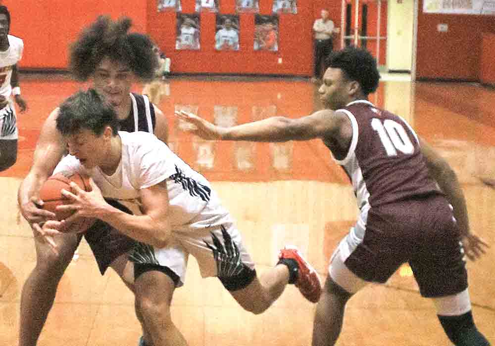 Groveton’s Daiton Chandler pushes his way through the Grapeland defense.  Photo Tony Farkas