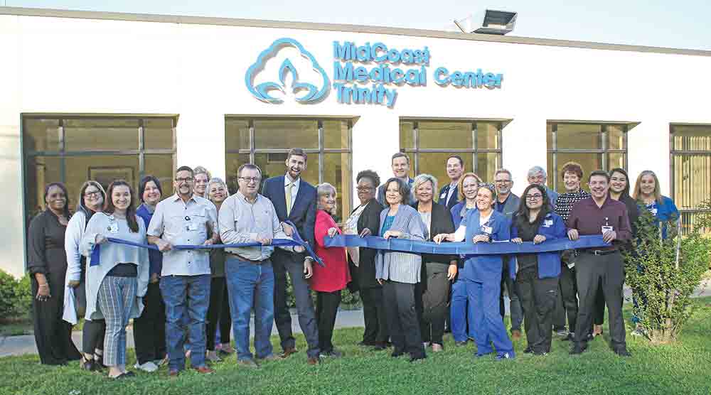 Trinity dignitaries, the hospital board and members of MidCoast Health Systems cut the ribbon on MidCoast Medical Center Trinity.  Photos by  Tony Farkas