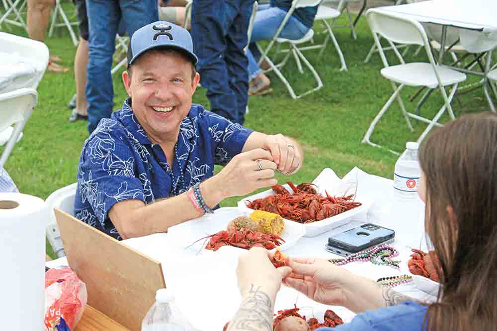 Trinity Mayor Billy Goodin enjoys the crawfish. 