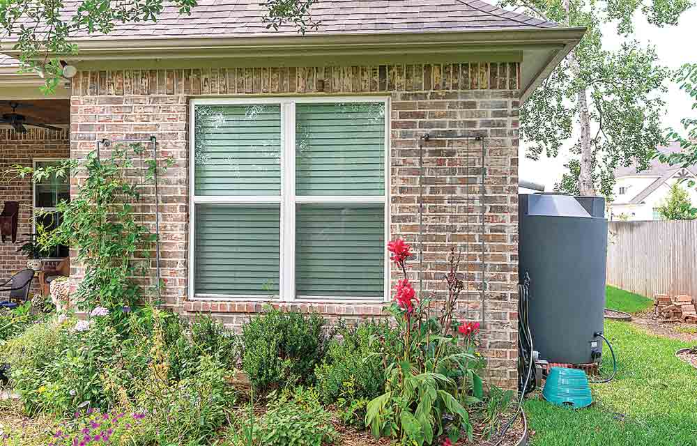 Garden resolutions for 2024 may include saving water. Utilizing a catchment system off a home’s rain gutter is a great way to help keep gardens growing during times of drought. Texas A&M AgriLife photo by Michael Miller 