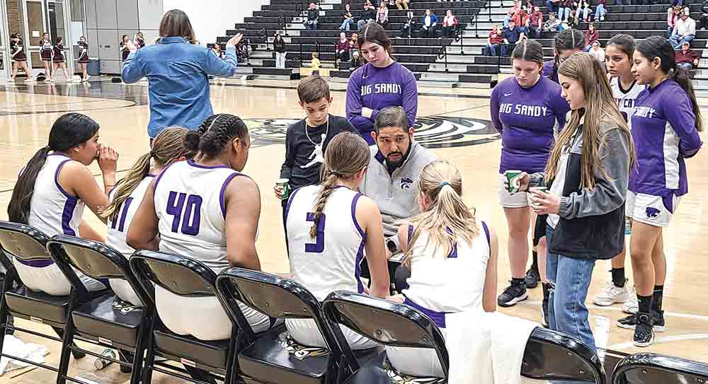 Big Sandy coach Ryan Alec goes over strategy with the team in the fourth quarter.