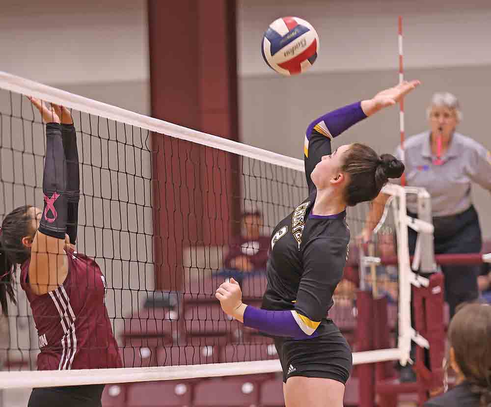 Lady Jacket Marae Pounds defends the net Friday vs Garrison. BECKI BYRD | TCB 