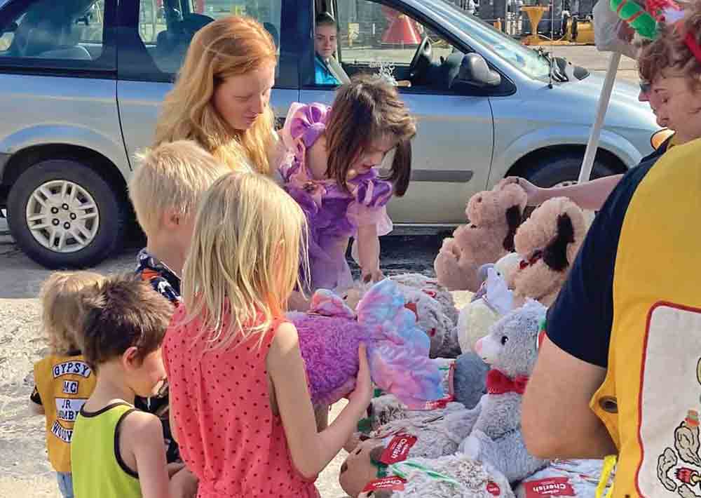 Children enjoy toys given by the Gypsy MC COURTESY PHOTO 