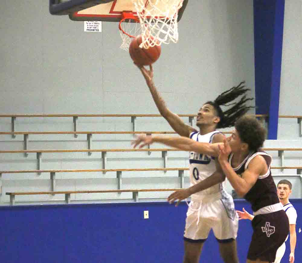 Michael Kenney flies past a defender for the bucket.