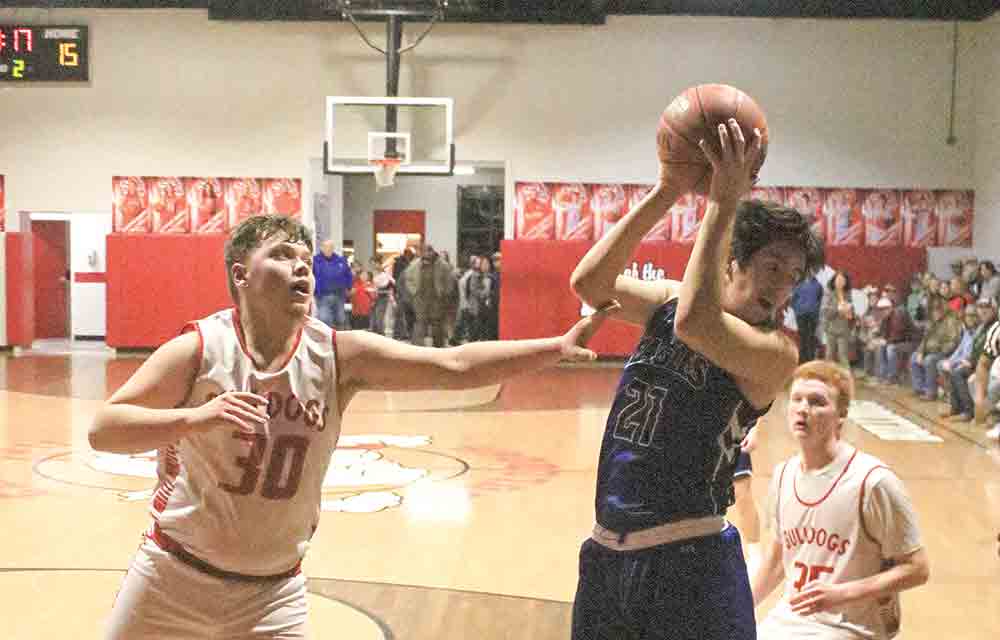 Eagle Ethan Randell (No. 21) pulls in the rebound.