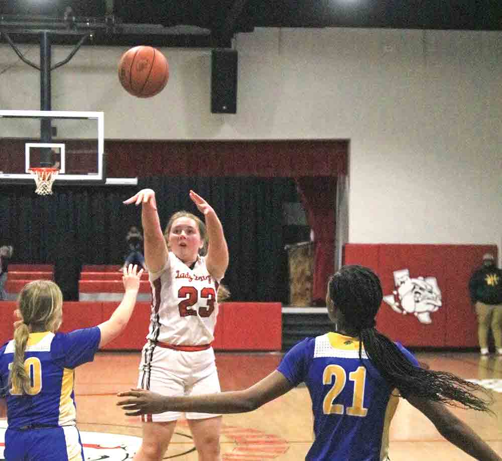 Centerville’s Taylor Barton (No. 23) puts up a shot against Oakwood