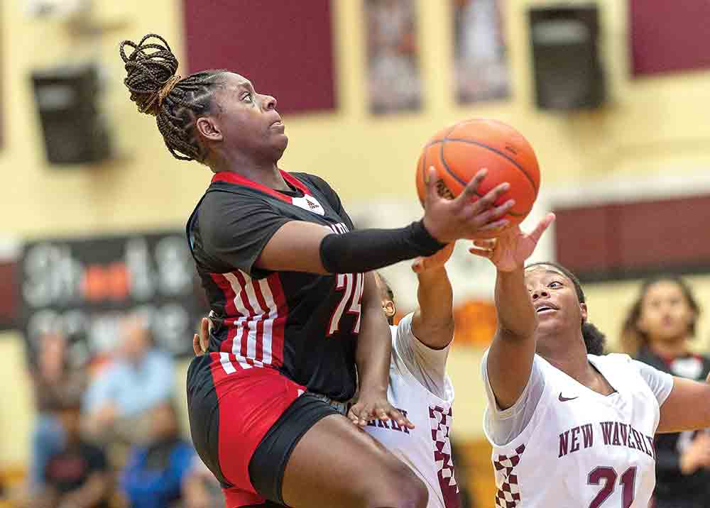 Honesti Bradford grabs a layup against a tough Lady Bulldog defense. See more photos on page  9. Photos by Charles Ballard