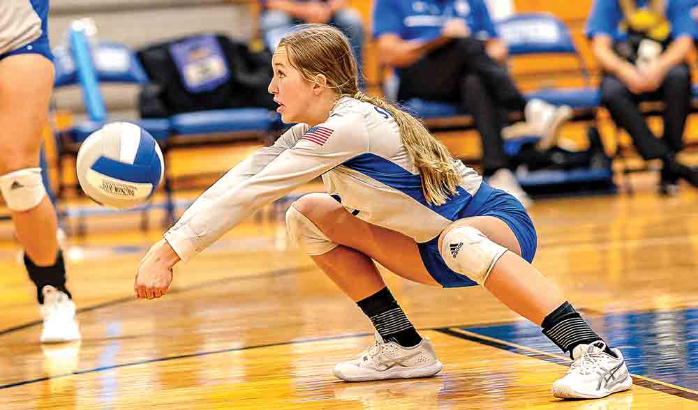 Sarah Downey digs one out for another setup during the Onalaska volleyball game.  Photos by Charles Ballard