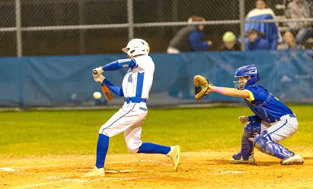 Cyrus Martinez connects with a Hornet fastball during the first season game.