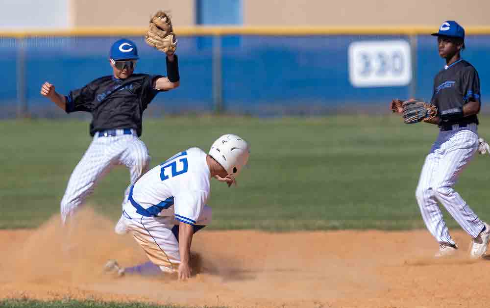 Hagan Adams slides in safe stealing second base.