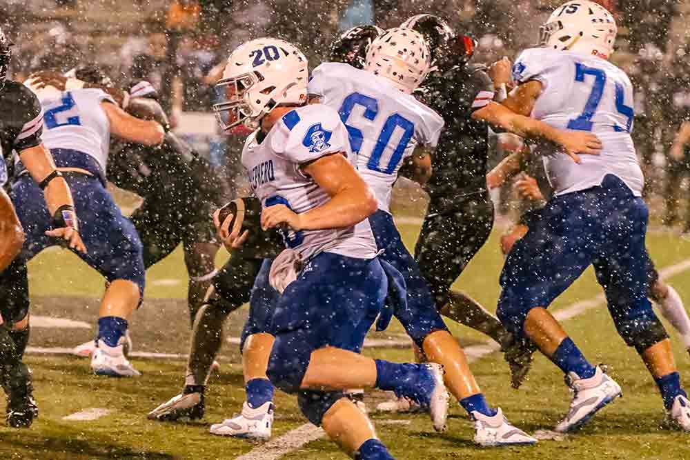 Preston Stephens receives great protection by Jacob Davis (No. 60) and Noah Castro (No. 75) during the win over the Kirbyville Wildcats.  Photo by Rigoberto Uriegas 