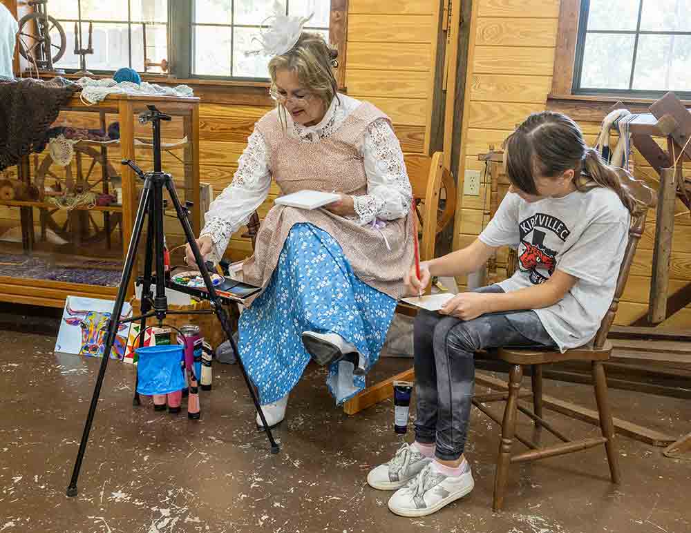 Painting was one of many fine arts on display and being demonstrated for festival goers at the 34th annual Harvest Festival at Heritage Village. JIM POWERS | TCB