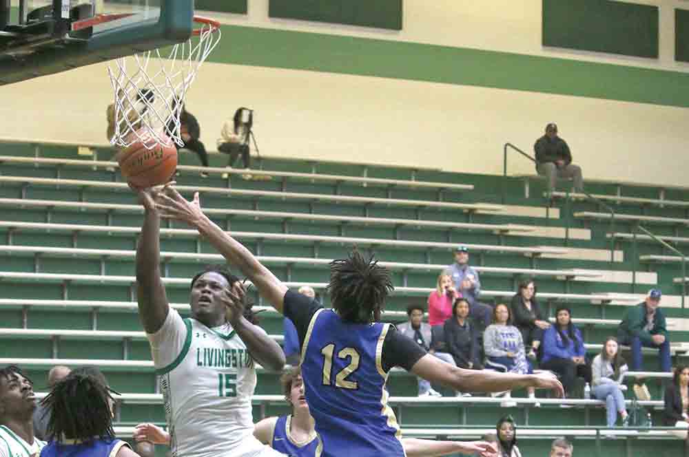  J.T. Randolph lifts the shot over a leaping Longhorn