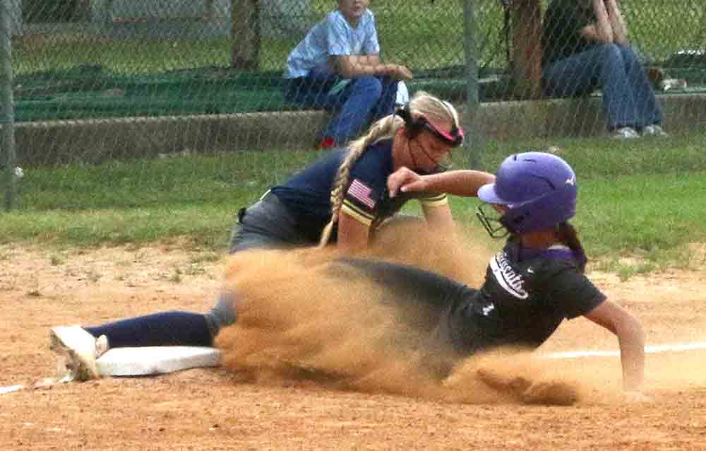  Jaycie Blankenbaker slides in safe at third base.