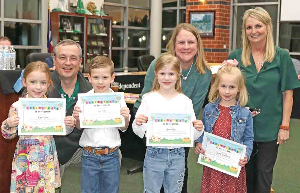 LISD Superintendent Dr. Brent Hawkins (back row, L-R), Pine Ridge Principal Sarah Hans, LISD Chief Academic Officer Lisa Cagle honor kindergarten students (front row, L-R) Ryen Stutts, Jace Loftin, Danni Bass, and Norah Burkhardt, who received certificates for outstanding academic performance in literacy. COURTESY PHOTO