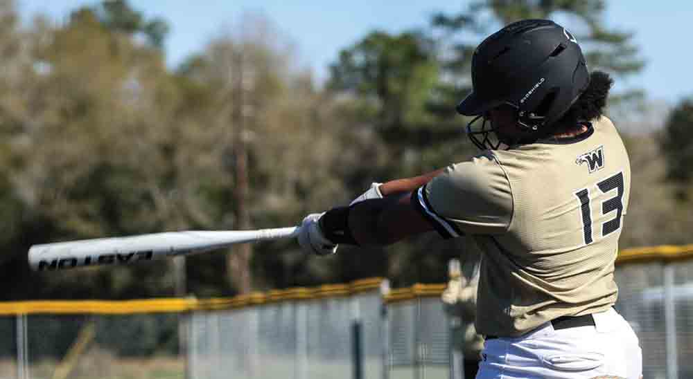 Jade McQueen hits solo home run to right field in the bottom of the first inning. PHOTO BY JASON DRAKE