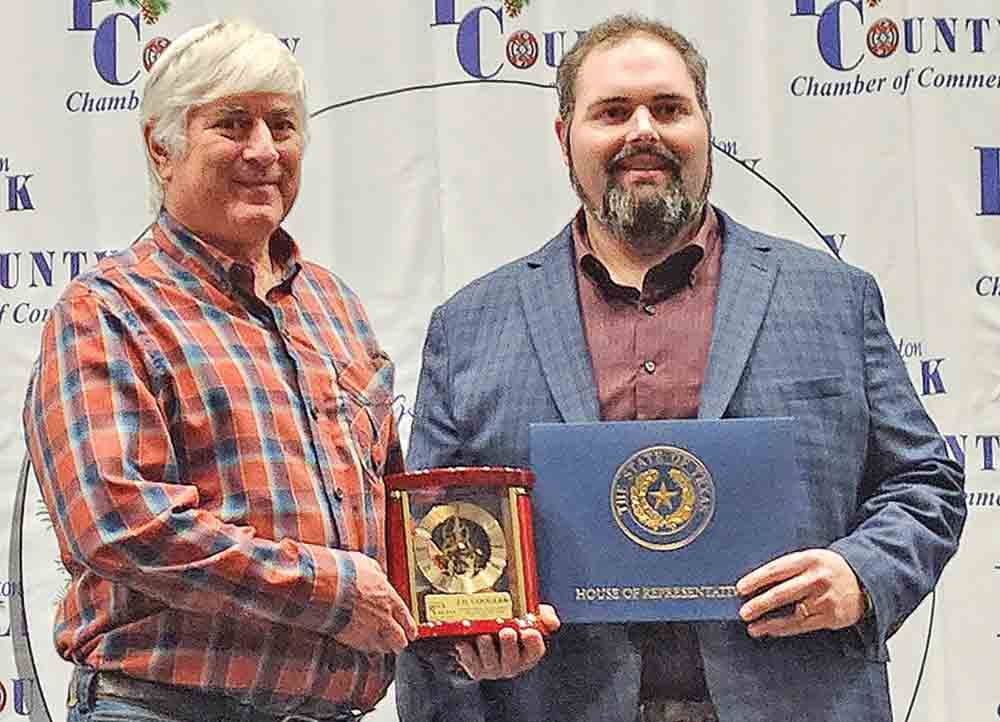 During the 88th annual Awards Gala of the Livingston-Polk County Chamber of Commerce Thursday, Keith Coogler accepted the Outstanding Polk County Citizen of the Year Award on behalf of his father, J.D. Coogler Jr., who was unable to attend. (l-r) Keith Coogler and Andrew Boyce, outgoing chamber board chairman.  Photo by Emily Banks Wooten