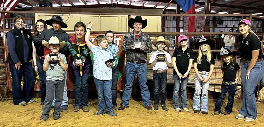 Participants in the No Limits show are all smiles after winning their belt buckles at the Trinity County Fair and Youth Livestock Show. Courtesy photo