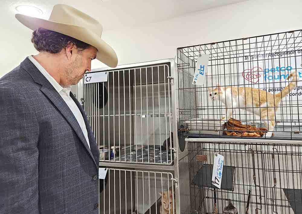 U.S. Congressman Morgan Luttrell checks out some of the cats in the cattery and some of the dogs in the outdoor kennels at the SPCA of Polk County’s animal shelter located at 802 S. Houston in Livingston on Monday. Luttrell toured the facility to determine if he can assist with any of their needs. Photo by Emily Banks Wooten