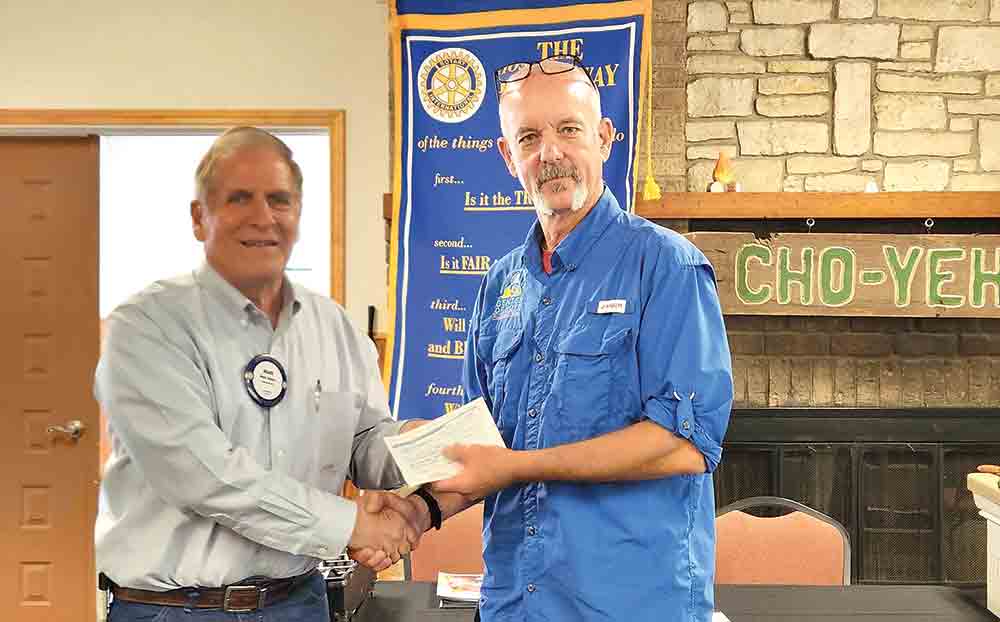 On behalf of the Rotary Club of Livingston, Rotarian Mark Waters presents a check to Mike Fortney for the Center of Hope. Photo by Emily Banks Wooten