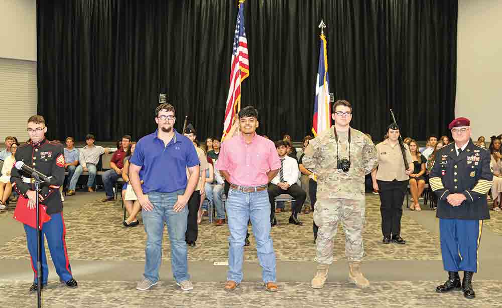 MILITARY HONORS — Four senior students have chosen to serve in the military following graduation. Jacob Noonan is entering the U.S. Air Force. Marcos Machuca is entering the U.S. Marines. Kevin Vincent and Cody White are entering the U.S. Army. (l-r) U.S. Marine Corps Recruiter Sgt. Jonathan Noblin Marine Corps, Noonan, Machuca, Vincent and Naval Science Teacher Sergeant First Class Grady Tinker US Army Retired. Not pictured: Cody White. Courtesy photo