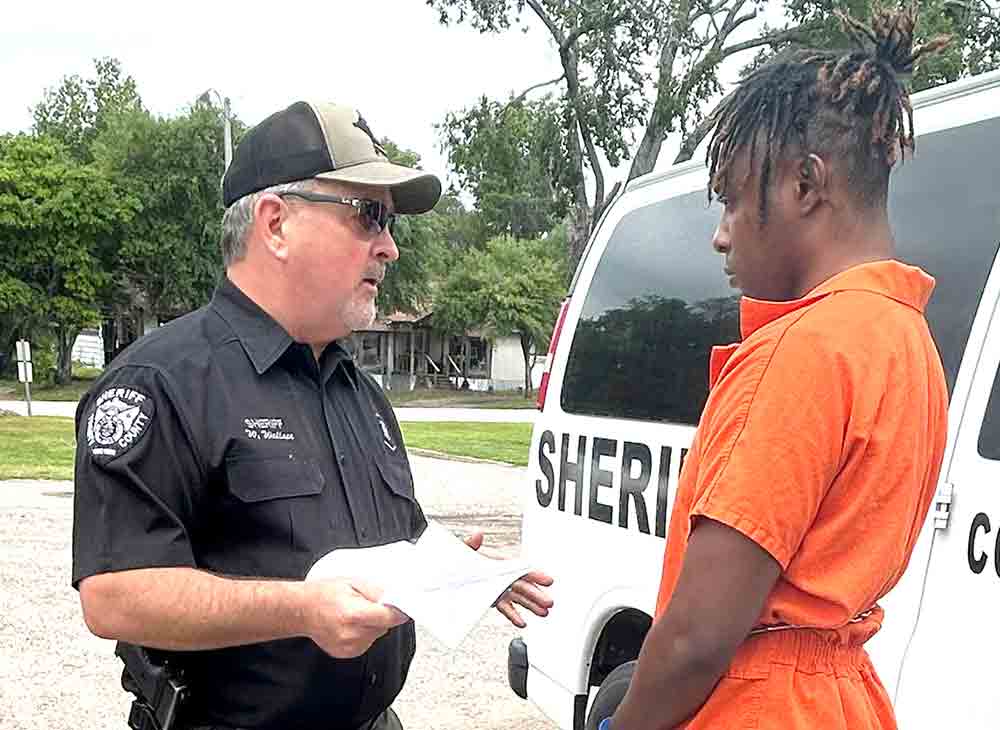 Trinity County Sheriff Woody Wallace talks with Treyvaun Crawford following his sentencing for intoxicated manslaughter and sexual assault.  Courtesy photo