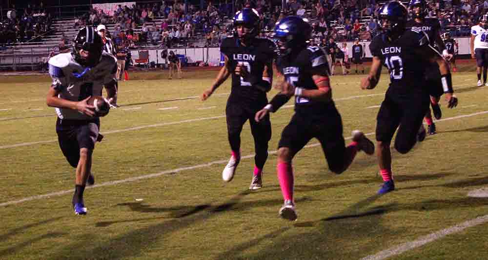 Bulldog sophomore quarterback Michael Sullivan takes a bold run to the pylon for a two-point conversion.