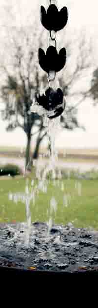 RAINWATER HARVEST -- A rain chain is a decorative element that can hang from the edge of a roof to direct rainwater down into a barrel below. PHOTO COURTESY OF TEXAS A&M AGRILIFE