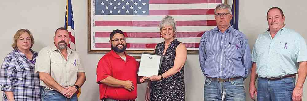 On behalf of the local chiropractic and physical therapy communities, Dr. Kenneth Dominguez accepts a proclamation from the Polk County Commissioners Court recognizing Oct. 16 as World Spine Day. (l-r) Precinct 1 Commissioner Guylene Robertson, Precinct 2 Commissioner Mark Dubose, Dr. Kenneth Dominguez, County Judge Sydney Murphy, Precinct 4 Commissioner Jerry Cassity and Precinct 3 Commissioner Milt Purvis. Photo by Emily Banks Wooten