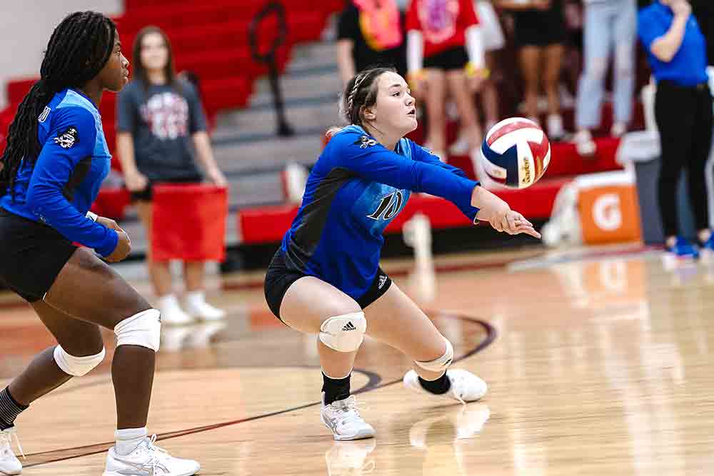 Adison Simpson grabs a setup during the game against the Lady Wildcats. Photos by Charles Ballard